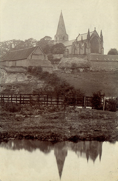 An old photograph of Cloudside Farm and St. Giles' Church